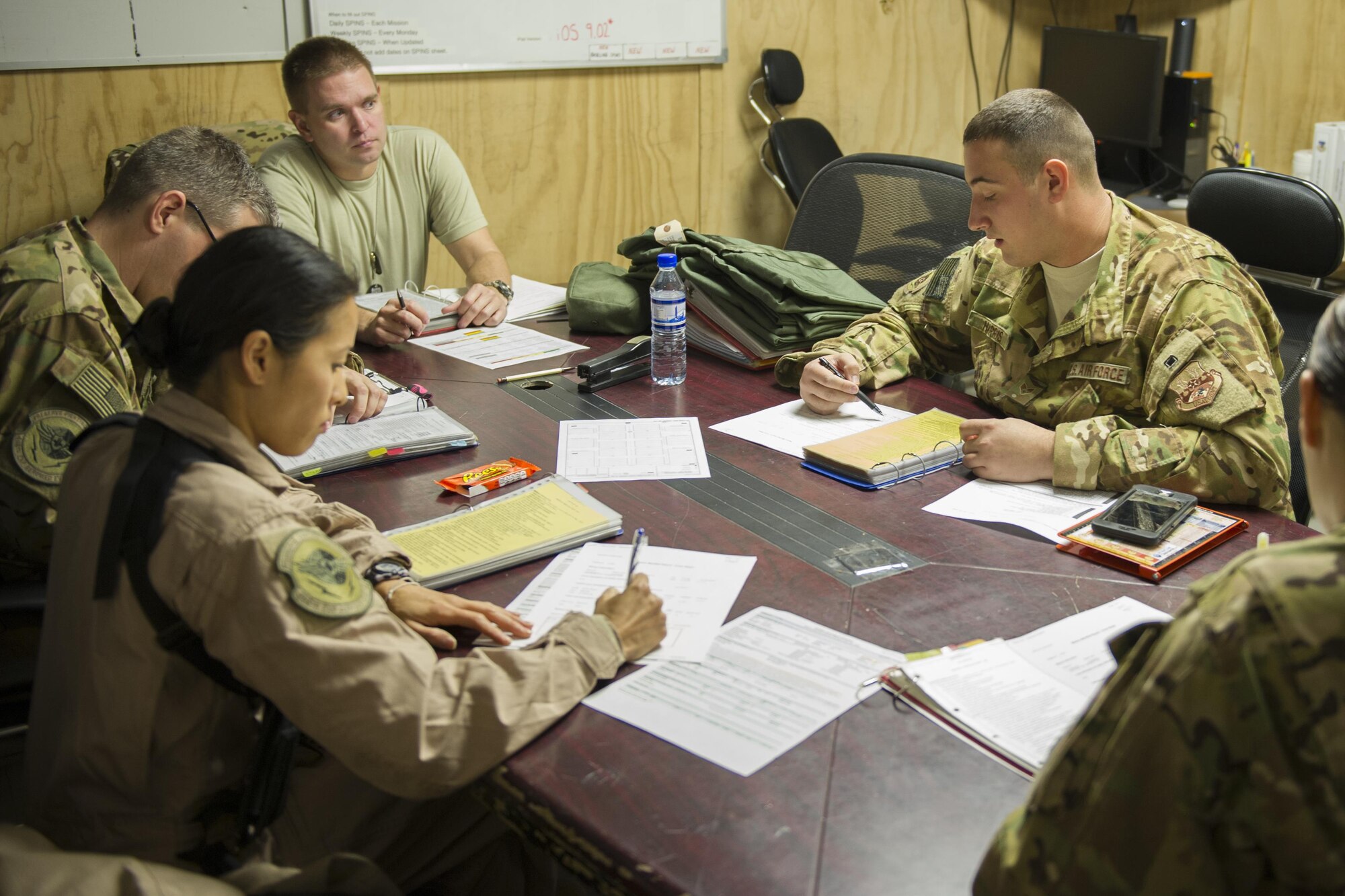 Senior Airman Justin Harris (right), 455th Expeditionary Aeromedical Evacuation Squadron medical technician, deployed from the 167th AES at Charleston Air National Guard Base, W.Va., gives a charge medical technician brief prior to departing for an alert mission at Bagram Airfield, Afghanistan, Nov. 6, 2015. The briefing ensures the AE team understands their roles when setting up medical equipment and ensures safety on the aircraft. (U.S. Air Force photo by Tech. Sgt. Robert Cloys/RELEASED)