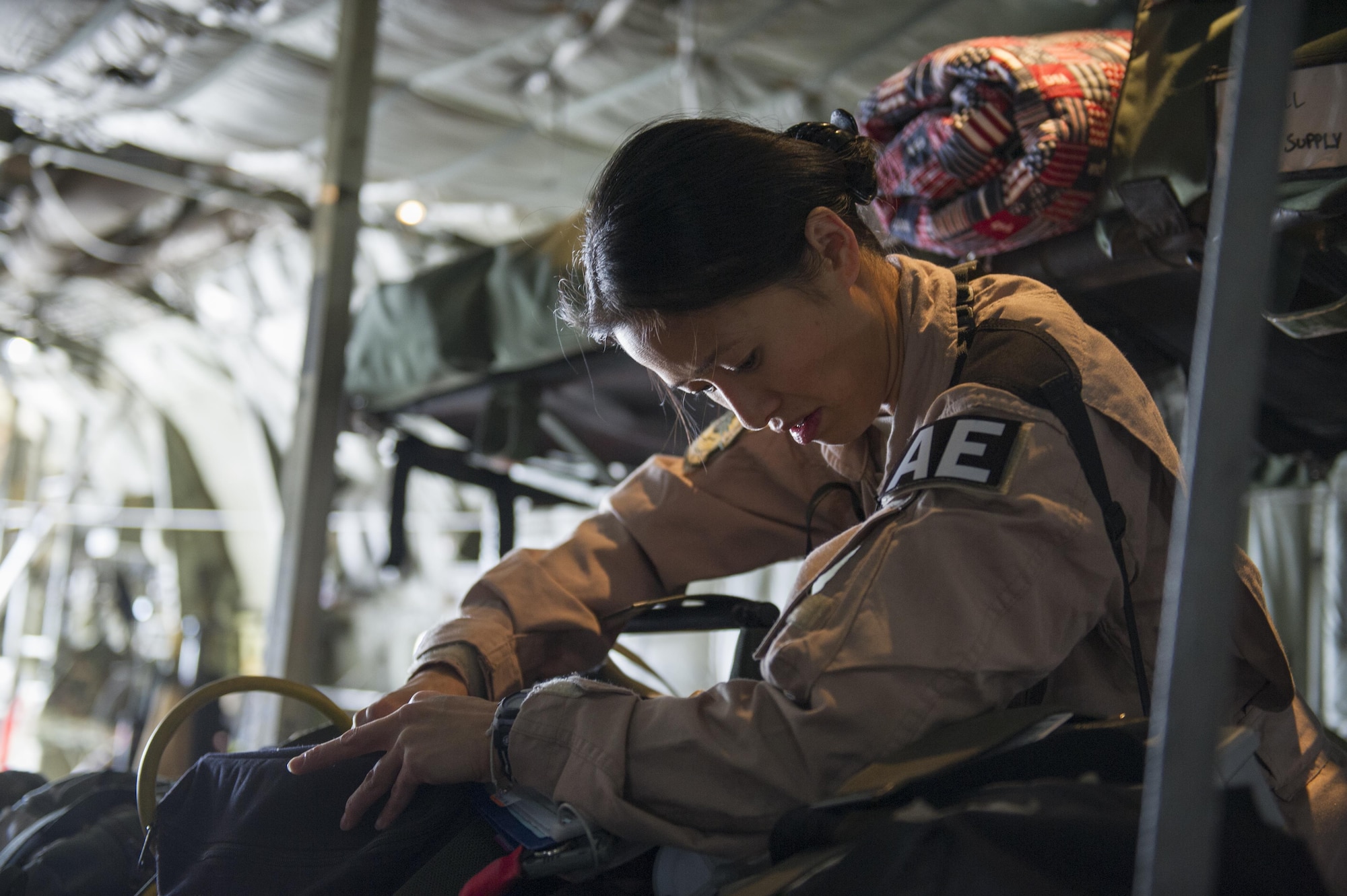 Tech. Sgt. Audrey Belmonte, 455th Expeditionary Aeromedical Evacuation Squadron medical technician deployed from the 167th AES at Charleston Air National Guard Base, W.Va., checks medical gear aboard a C-130 Hercules in preparation for a medevac mission at Bagram Airfield, Afghanistan, Nov. 6, 2015. The 455th EAES is tasked with moving injured and sick patients to locations with higher levels of medical care. (U.S. Air Force photo by Tech. Sgt. Robert Cloys/RELEASED)