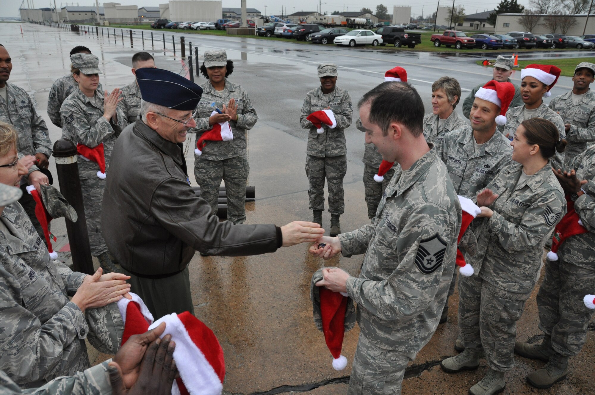 Col. Jonathan Philebaum, 512th Operations Group commander, presents two commander’s coins to Master Sgt. Ian Crowley, 512th Force Support Squadron, during the 512th Airlift Wing’s Holiday Social Nov. 7, 2015, at Dover Air Force Base, Del. The first commander’s coin was for Crowley’s distinguished support to the 512th OG and the second was for his promotion to senior noncommissioned officer. (U.S. Air Force photo/Staff Sgt. Joe Yanik)