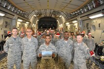 SrA Michael Mann, 512th Force Support Squadron, displays his certificate for the Diamond Sharp Award in front of his squadron wingmen Nov. 7, 2015, at Dover Air Force Base, Del. The award, presented to Mann by the Dover Diamond Council, is in recognition of his outstanding service and dedication to duty. (U.S. Air Force/Staff Sgt. Joe Yanik)