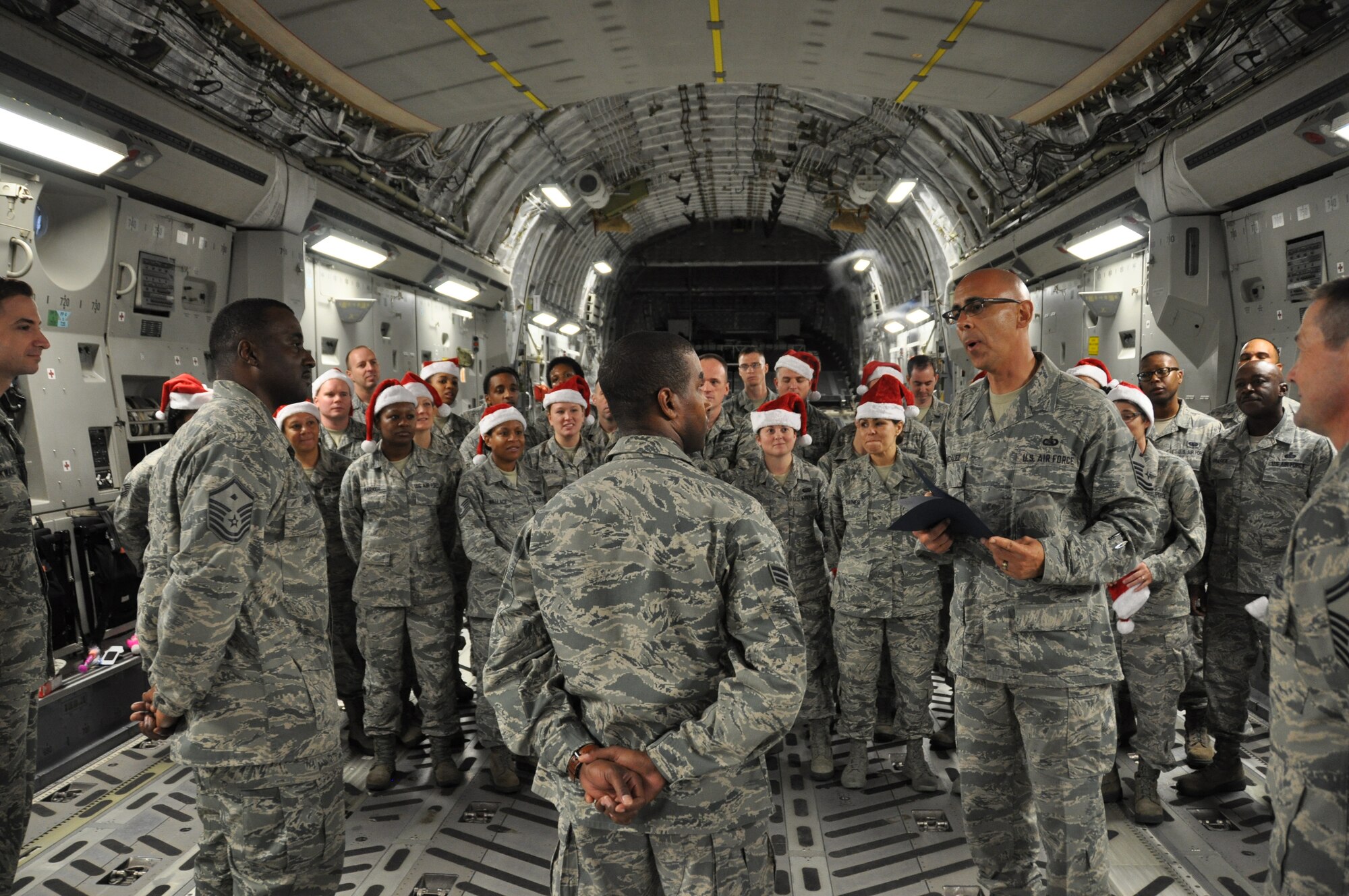 Master Sgt. Juan Gonzalez (foreground second from left), 512th Force Support Squadron first sergeant, presents a certificate for the Diamond Sharp Award to SrA Michael Mann, 512th Force Support Squadron, in front of his squadron wingmen during the 512th Airlift Wing's Holiday Social Nov. 7, 2015, at Dover Air Force Base, Del. The award, presented to Mann by the Dover Diamond Council, is in recognition of his outstanding service and dedication to duty. (U.S. Air Force/Staff Sgt. Joe Yanik)