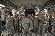 Master Sgt. Juan Gonzalez (foreground second from left), 512th Force Support Squadron first sergeant, presents a certificate for the Diamond Sharp Award to SrA Michael Mann, 512th Force Support Squadron, in front of his squadron wingmen during the 512th Airlift Wing's Holiday Social Nov. 7, 2015, at Dover Air Force Base, Del. The award, presented to Mann by the Dover Diamond Council, is in recognition of his outstanding service and dedication to duty. (U.S. Air Force/Staff Sgt. Joe Yanik)