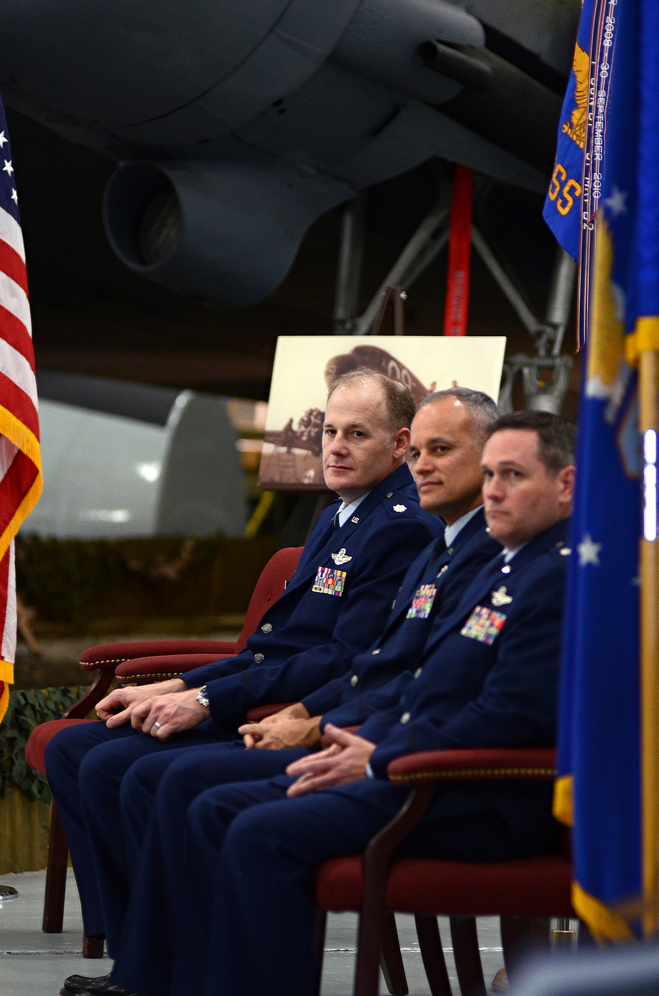 From left to right, Lt. Col. Michael Mundy, incoming 512th Operations Support Squadron commander, Lt. Col. Jay Miller. incoming 512th Airlift Control Flight commander, and Lt. Col. Jeffrey Snyder, 326th Airlift Squadron commander, listen to welcome remarks at the 512th Operations Group assumption of command and change of command ceremonies, Nov. 7, 2015 on Dover Air Force Base, Del. The 512th OG held simultaneous ceremonies for the three new reserve commanders and organizations here during the November Unit Training Assembly. (U.S. Air Force photo/1st Lt Steve Lewis)