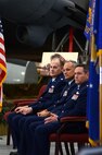 From left to right, Lt. Col. Michael Mundy, incoming 512th Operations Support Squadron commander, Lt. Col. Jay Miller. incoming 512th Airlift Control Flight commander, and Lt. Col. Jeffrey Snyder, 326th Airlift Squadron commander, listen to welcome remarks at the 512th Operations Group assumption of command and change of command ceremonies, Nov. 7, 2015 on Dover Air Force Base, Del. The 512th OG held simultaneous ceremonies for the three new reserve commanders and organizations here during the November Unit Training Assembly. (U.S. Air Force photo/1st Lt Steve Lewis)
