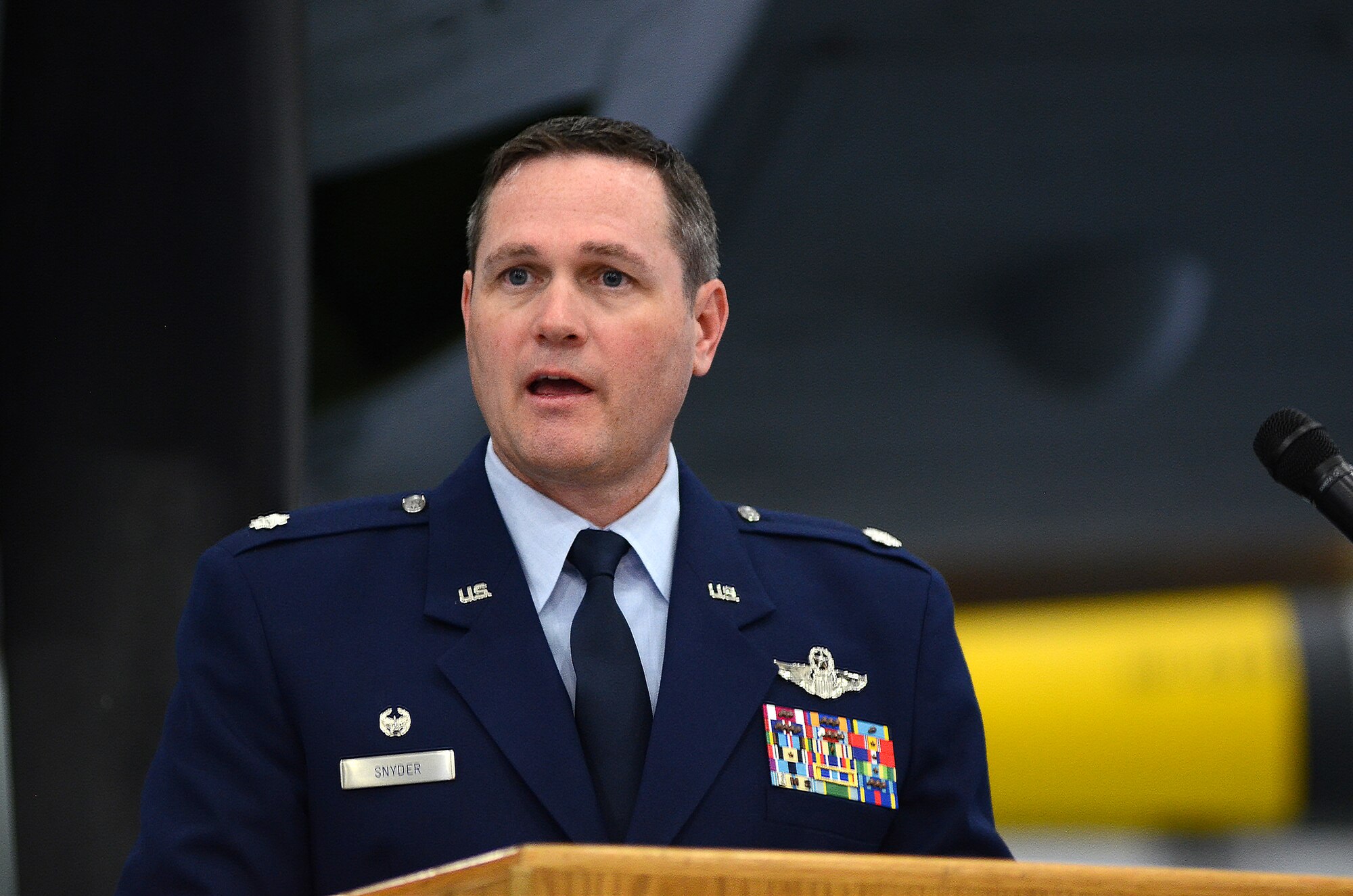 Lt. Col. Jeffrey Snyder, incoming 326th Airlift Squadron commander, provides remarks at the 512th Operations Group assumption of command and change of command ceremonies, Nov. 7, 2015 on Dover Air Force Base, Del. The 512th OG held simultaneous ceremonies for three new reserve commanders and organizations, including Colonel Snyder and the 326th AS, here during the November Unit Training Assembly. (U.S. Air Force photo/1st Lt. Steve Lewis)