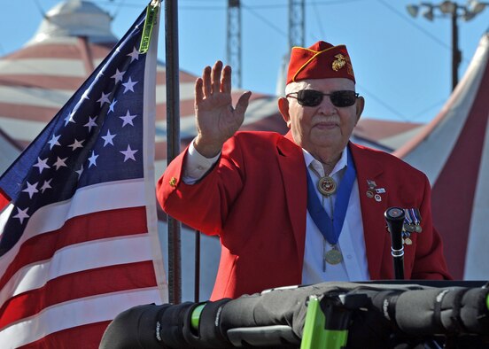Ray Urban , parade grand marshal and Marine Corps veteran, waves at the crowd during the Veterans Parade at the State Fair of Louisiana in Shreveport, La., Nov. 8, 2015. There are more than 21 million military veterans in the U.S., with more than 1.5 million who are women. (U.S. Air Force photo/ Senior Airman Joseph Raatz)