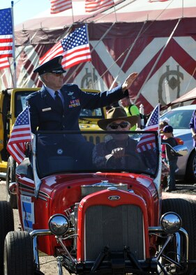 Retired U.S. Air Force Col. Lorenz Walker, current Bossier City mayor, waves to the crowd during the Veterans Parade at the State Fair of Louisiana in Shreveport, La., Nov. 8, 2015. Walker served for thirty years in the military, including two tours of duty during the Vietnam War, and retired in 1986. (U.S. Air Force photo/ Senior Airman Joseph Raatz)