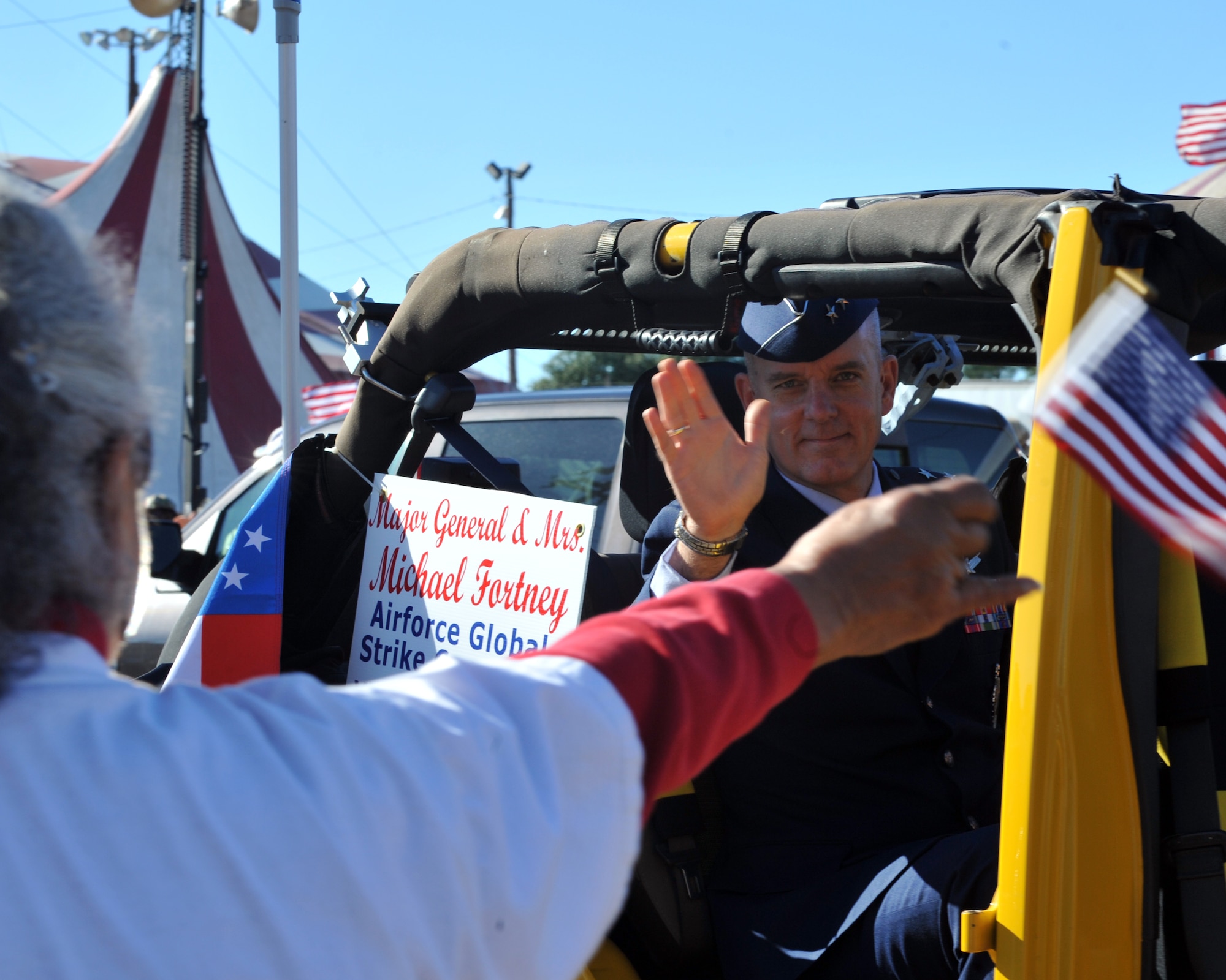 Maj. Gen. Michael Fortney, Air Force Global Strike Command vice commander, waves to a cheering bystander during the Veterans Parade at the State Fair of Louisiana in Shreveport, La., Nov. 8, 2015. Nearby Barksdale Air Force Base is the home of AFGSC, which oversees all nuclear bomber and missile forces in the U.S. (U.S. Air Force photo/ Senior Airman Joseph Raatz)