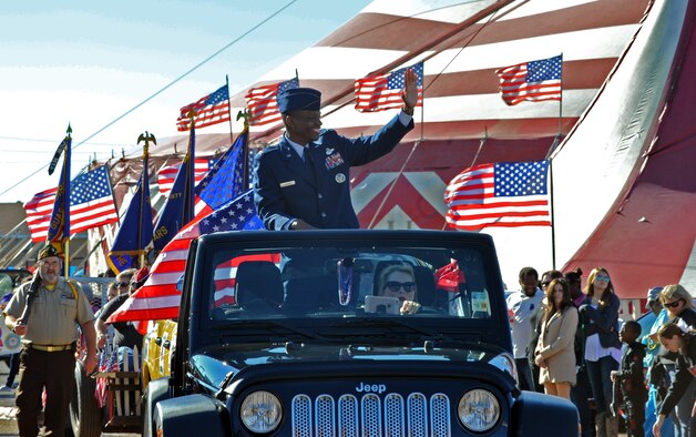 Col. Brandon Parker, 2nd Bomb Wing vice commander, greets the crowd during the Veterans Parade at the State Fair of Louisiana in Shreveport, La., Nov. 8, 2015. The 2nd BW has called nearby Barksdale Air Force Base home for more than 50 years. (U.S. Air Force photo/ Senior Airman Joseph Raatz)