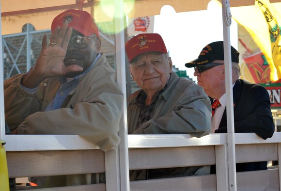 Members of the U.S. Marine Corps League greet the crowd during the Veterans Parade at State Fair of Louisiana in Shreveport, La., Nov. 8, 2015. Veterans Day is a federal holiday celebrated Nov. 11, during which Americans honor those who have served in the military. (U.S. Air Force photo/ Senior Airman Joseph Raatz)