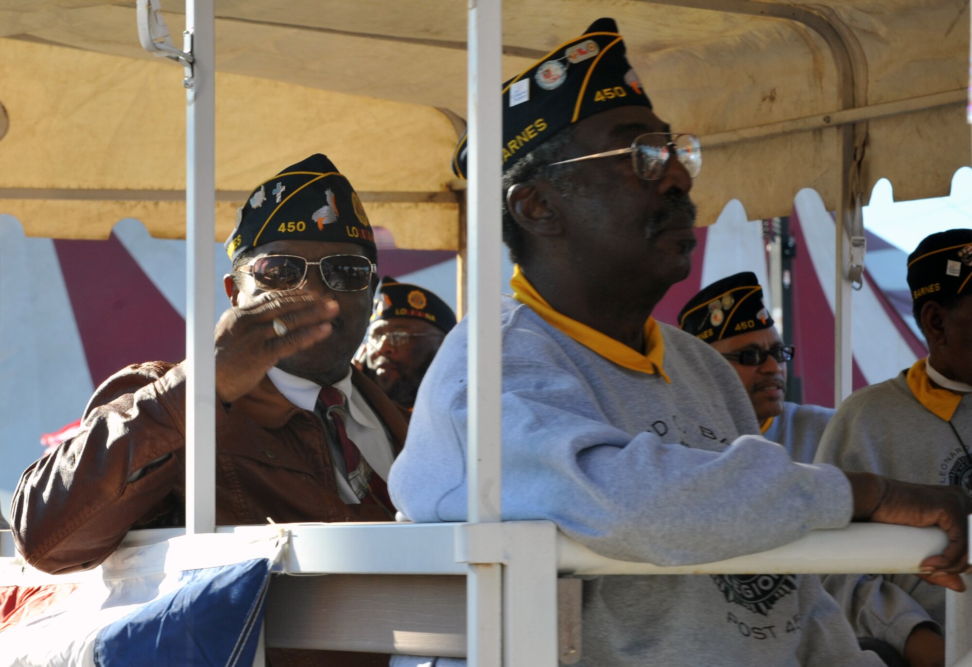 A member of the American Legion returns a salute from a crowd member during the Veterans Parade at State Fair of Louisiana in Shreveport, La., Nov. 8, 2015. Hundreds of spectators gathered for the parade to honor veterans participating in the festivities. (U.S. Air Force photo/ Senior Airman Joseph Raatz)