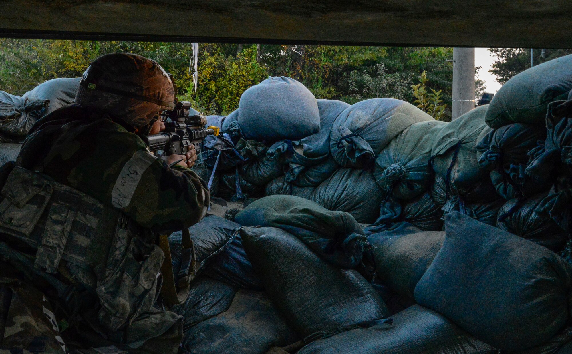 Airman 1st Class John Contreras, 51st Security Forces Squadron searches for opposing forces during readiness exercise Vigilant Ace 16 on Osan Air Base, Republic of Korea, Nov. 4, 2015. Throughout the week-long, peninsula-wide exercise, the defenders practiced various training scenarios vital to their real-world roles. (U.S. Air Force photo/Senior Airman Kristin High)