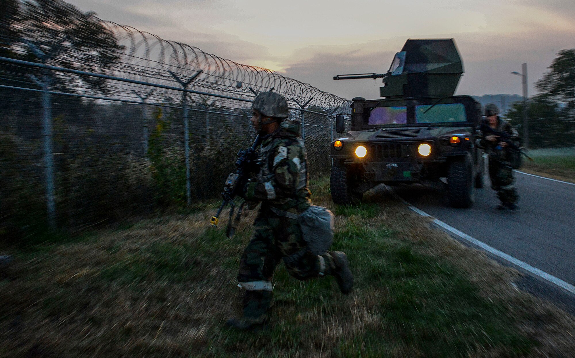 Defenders from the 51st Security Forces Squadron search for opposing forces during readiness exercise Vigilant Ace 16 on Osan Air Base, Republic of Korea, Nov. 4, 2015. During the week Airmen showcased their ability to position, employ and sustain forces during a variety of simulated attacks and situations. (U.S. Air Force photo/Senior Airman Kristin High)
