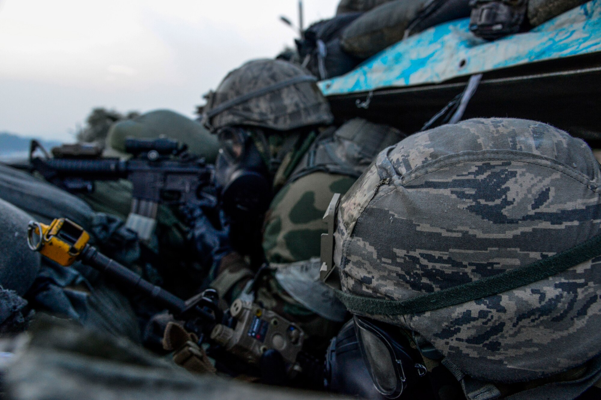 Airmen 1st Class John Contreras, (left), and Marlon Alcampor, 51st Security Forces Squadron, watch for opposing forces during readiness exercise Vigilant Ace 16 on Osan Air Base, Republic of Korea, Nov. 4, 2015. The simulated scenarios prepare defenders for real-world contingencies. Vigilant Ace 16 is a peninsula-wide exercise with more than 16,000 participants including more than 1,000 augmentees. (U.S. Air Force photo/Senior Airman Kristin High)