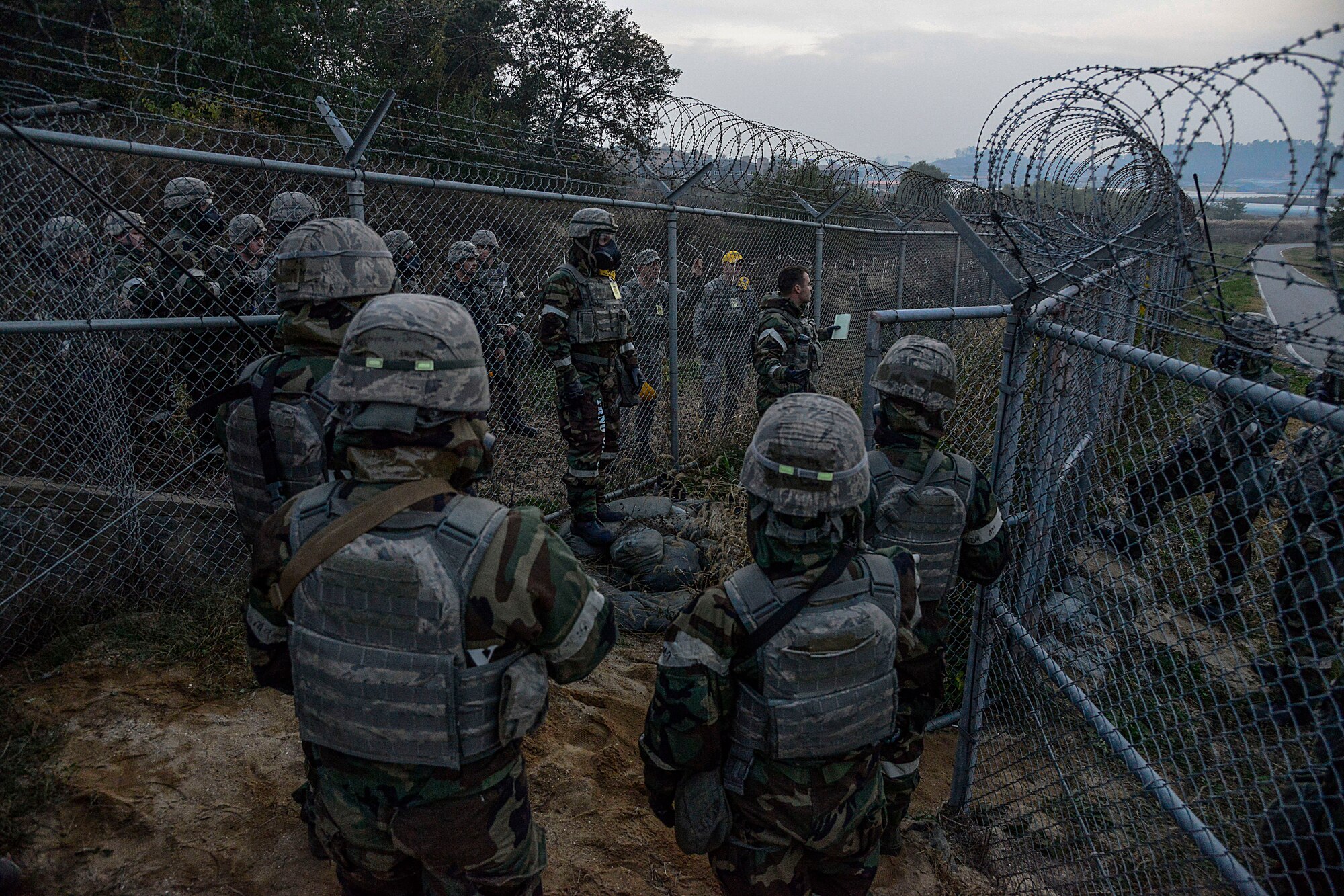 Defenders from the 51st Security Forces Squadron gather for an outbrief after a simulated opposing forces attack during readiness exercise Vigilant Ace 16 on Osan Air Base, Republic of Korea, Nov. 4, 2015. Vigilant Ace 16 is part of a continuous exercise schedule on the peninsula, strengthening the U.S. and ROK alliance and helping both nations fulfill their obligations to the Mutual Defense Treaty. The exercise gave the defenders an opportunity to train for real-world contingencies using various scenarios. (U.S. Air Force photo/Senior Airman Kristin High)