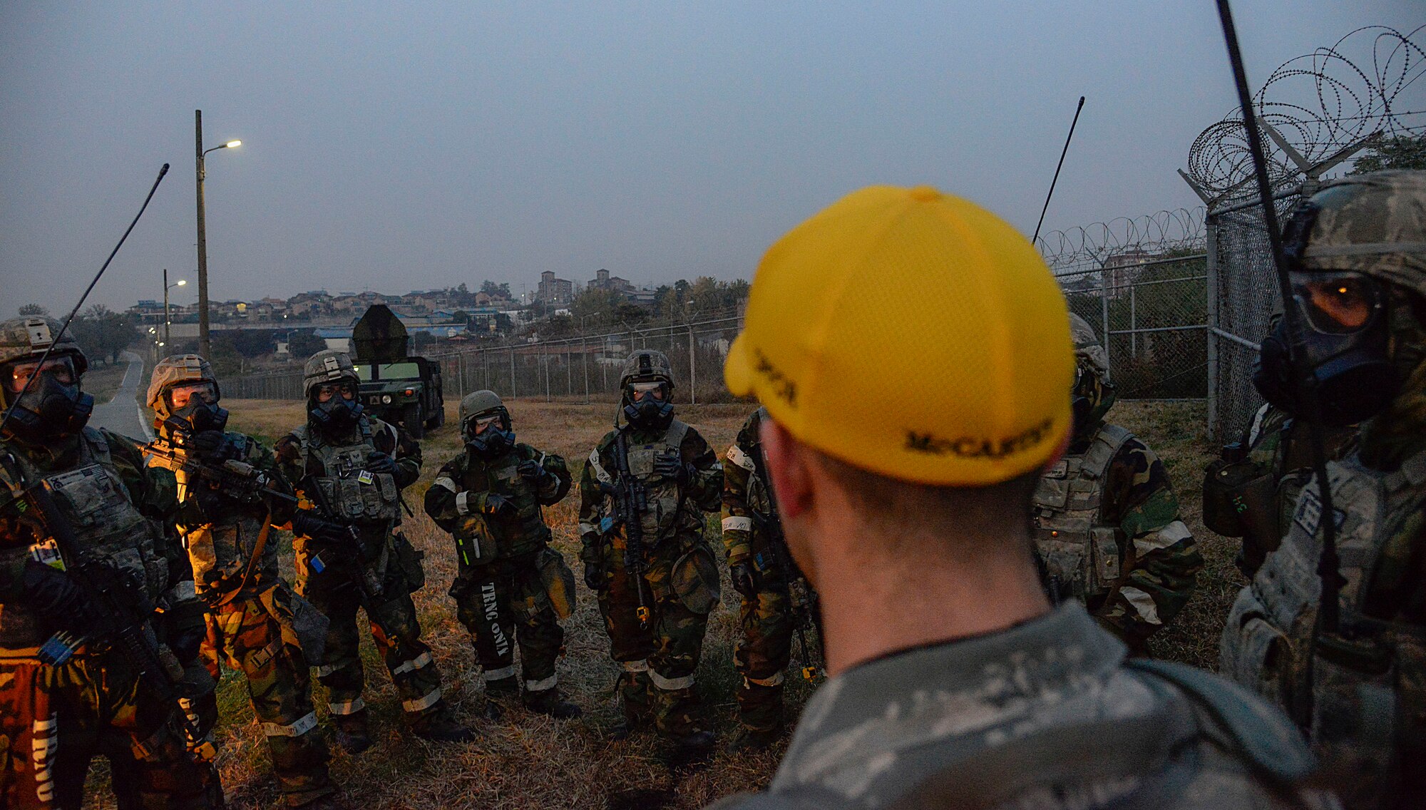 Staff Sgt. Kevin McCarthy, 51st Security Forces Squadron wing inspection team member, speaks with defenders after a simulated opposing forces attack during readiness exercise Vigilant Ace 16 on Osan Air Base, Republic of Korea, Nov. 4, 2015. The exercise gave defenders an opportunity to train for real-world contingencies using various scenarios. Once the simulated attack scenarios were complete, team members gathered with WIT members to discuss what happened in each portion of the scenario. Team leads and WIT members gave constructive criticism during the feedback to ensure Airmen understand where to improve next. (U.S. Air Force photo/Senior Airman Kristin High)