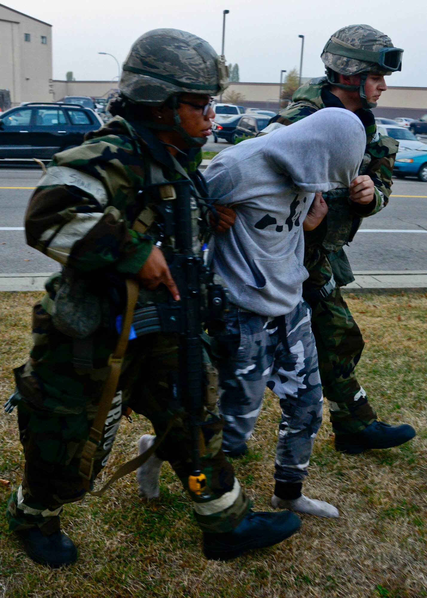 Airman Gun Pak, 51st Security Forces Squadron, is detained during readiness exercise Vigilant Ace 16, on Osan Air Base, Republic of Korea, Nov. 4, 2015. Throughout the exercise, defenders used Team Osan Airmen and augmentees from the 35th SFS, Misawa Air Base, Japan, as opposing forces to simulate real-world conditions. (U.S. Air Force photo/Senior Airman Kristin High)