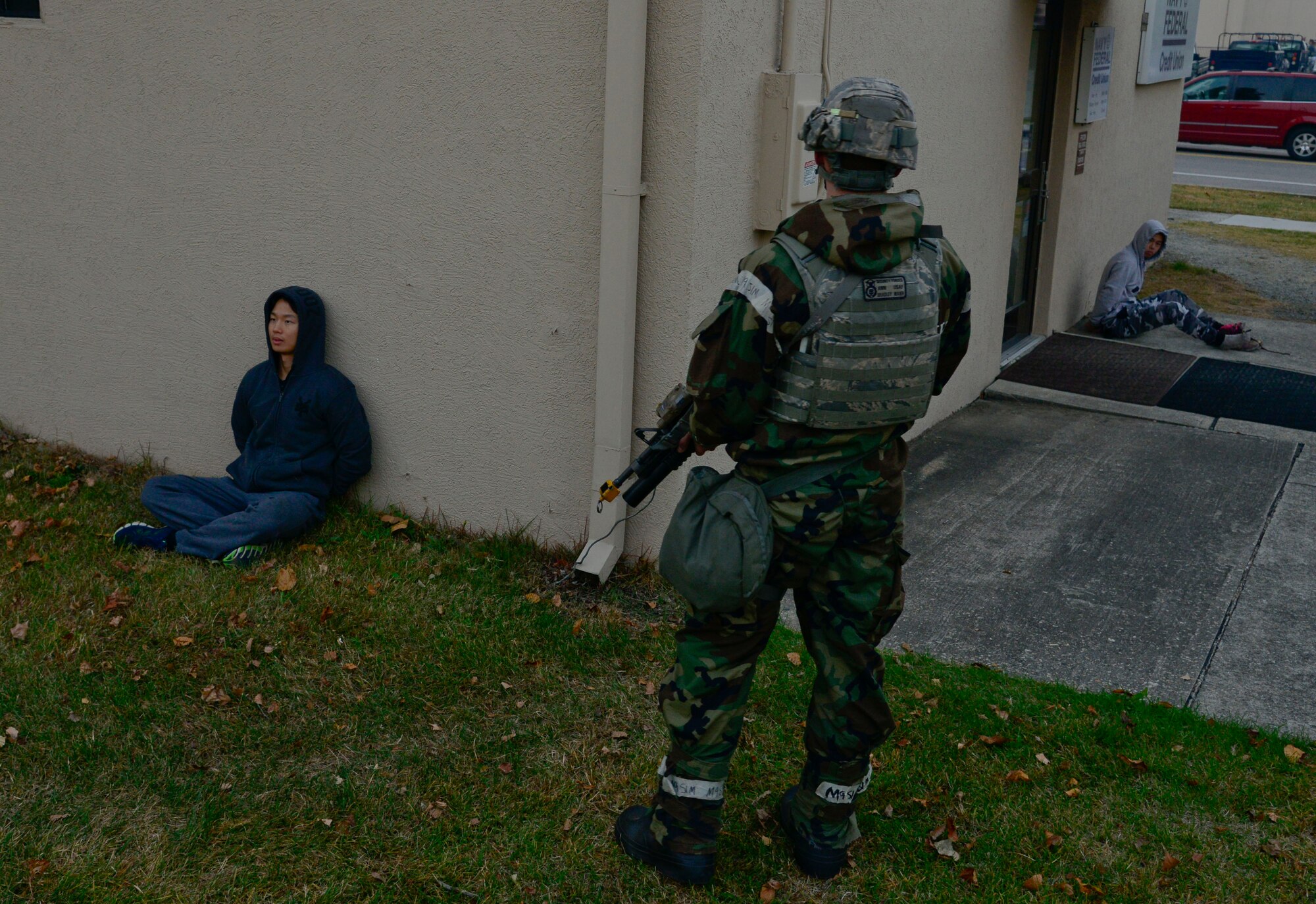 Opposing forces, played by 51st Security Forces Squadron defenders, are detained during readiness exercise Vigilant Ace 16, on Osan Air Base, Republic of Korea, Nov. 4, 2015. In real-world conditions, detainees are kept safe from gun-fire but separated from each other. Vigilant Ace 16 allows Airmen to demonstrate combat skills. More than 16,000 U.S. and ROK forces personnel participated in the exercise. (U.S. Air Force photo/Senior Airman Kristin High)