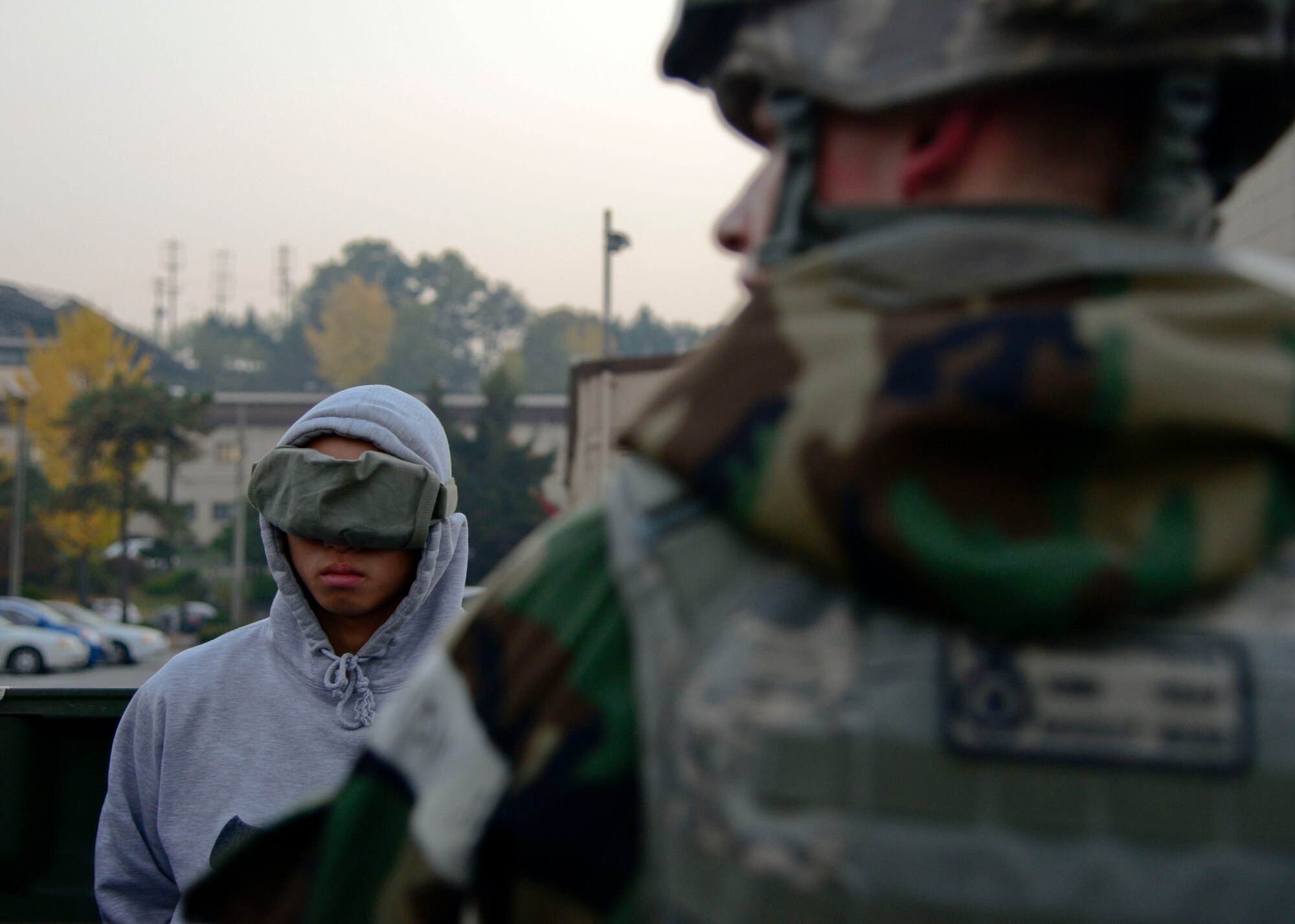Airman Gun Pak, 51st Security Forces Squadron, is detained during readiness exercise Vigilant Ace 16, on Osan Air Base, Republic of Korea, Nov. 4, 2015. The peninsula-wide exercise is an annual event with more than 16,000 participants from U.S. and ROK forces. Vigilant Ace 16 brought more than 1,000 augmentees to participate. (U.S. Air Force photo/Senior Airman Kristin High)