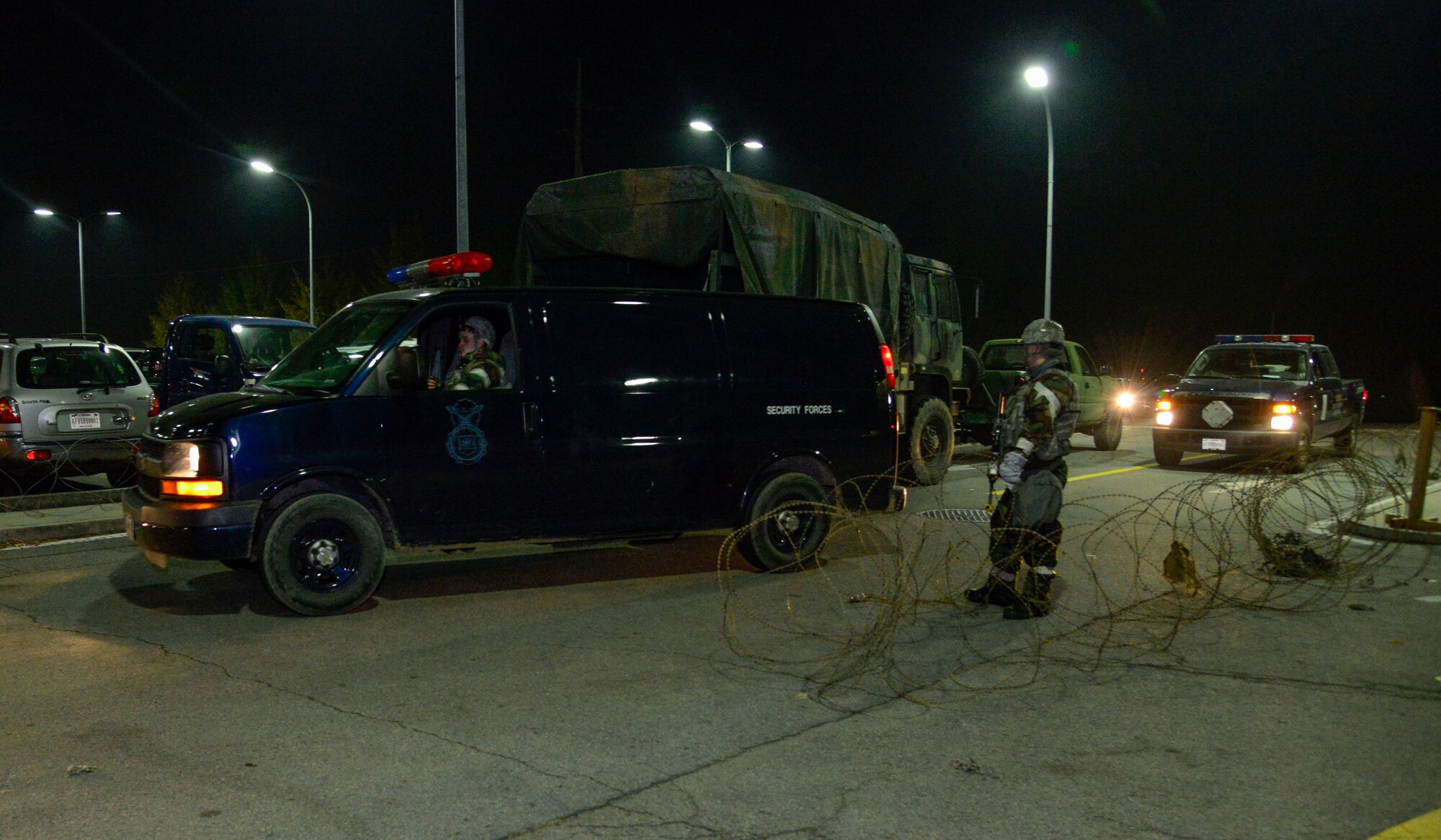 Military working dog handlers move quickly to evacuate the MWDs during readiness exercise Vigilant Ace 16 on Osan Air Base, Republic of Korea, Nov. 4, 2015. During the exercise, the handlers simulated a fire outbreak at the kennels and needed to quickly evacuate the MWDs to a secondary location. (U.S. Air Force photo/Senior Airman Kristin High)