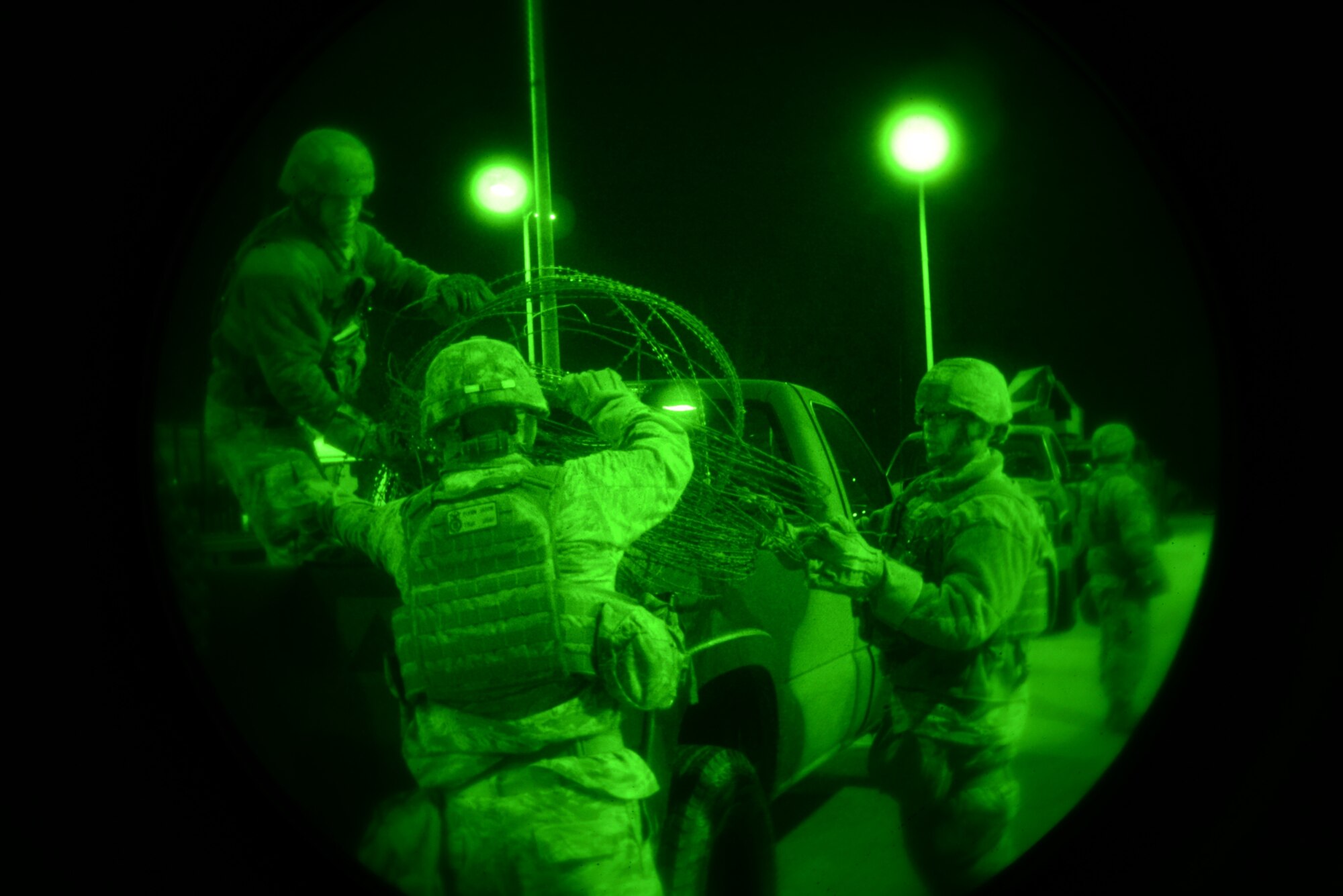 Airmen from the 51st Security Forces Squadron put away excess concertina wire as a team during the Vigilant Ace 16 exercise on Osan Air Base, Republic of Korea, Nov. 2, 2015. Security forces members are in charge of protecting the base and its population in the event of an adversarial attack. More than 16,000 U.S. personnel will participate in Vigilant Ace 16, a large-scale training exercise that helps prepare the alliance to respond to any potential contingencies and to defend the Republic of Korea. (U.S. Air Force photo/Tech. Sgt. Travis Edwards)