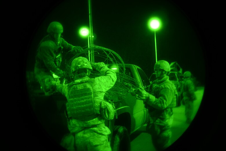 Airmen from the 51st Security Forces Squadron put away excess concertina wire as a team during the Vigilant Ace 16 exercise on Osan Air Base, Republic of Korea, Nov. 2, 2015. Security forces members are in charge of protecting the base and its population in the event of an adversarial attack. More than 16,000 U.S. personnel will participate in Vigilant Ace 16, a large-scale training exercise that helps prepare the alliance to respond to any potential contingencies and to defend the Republic of Korea. (U.S. Air Force photo/Tech. Sgt. Travis Edwards)