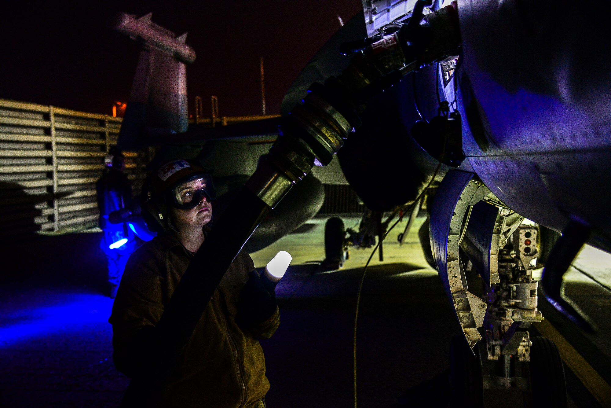 Navy Aviation Electrician's Mate Airman Apprentice Summer Blake, with Electronic Attack Squadron (VAQ) 132 from Naval Air Station Whidbey Island, Wash., ensures an EA-18G Growler properly receives fuel on the flight line during exercise Vigilant Ace 16 at Osan Air Base, Republic of Korea, Nov. 4, 2015.  The Navy's EA-18Gs are at Osan to participate in exercise Vigilant Ace 16 with their vast array of sensors and weapons capabilities. Exercise Vigilant Ace 16 is a peninsula-wide readiness exercise focused on strengthening the ROK and U.S. alliance incorporating members of four branches of the U.S. armed forces. (U.S. Air Force photo/Tech. Sgt. Travis Edwards)