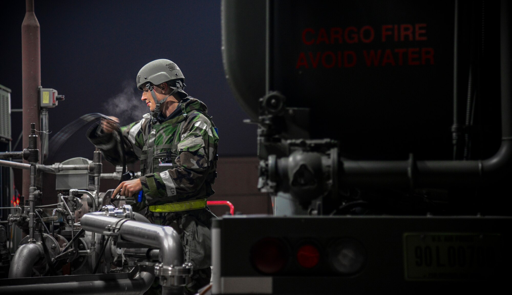 Airman 1st Class Lucas Amodeo, 51st Logistics Readiness Squadron fuels flight aircraft refueling specialist, prepares an R-11 mobile fuel truck to receive JP-8 jet fuel during exercise Vigilant Ace 16 at Osan Air Base, Republic of Korea, Nov. 4, 2015. The R-11 tanker can hold up to 6,000 gallons of fuel and can issue it out at 600 gallons per minute. Exercise Vigilant Ace 16 is a peninsula-wide exercise used to enhance the ROK and U.S. alliance through operational- and tactical-level training. (U.S. Air Force photo/Tech. Sgt. Travis Edwards)