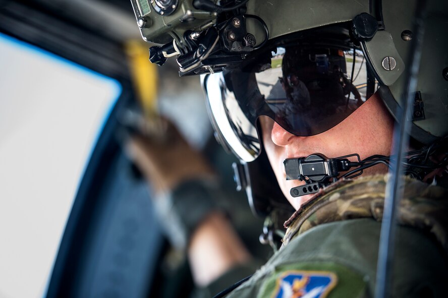 U.S. Air Force Tech. Sgt. Russell Hunt, 41st Rescue Squadron special missions aviator, looks out the back of an HH-60G Pave Hawk during the Thunder Over South Georgia Open House Nov. 7, 2015, at Moody Air Force Base, Ga. The CSAR demonstration showcased Moody's capabilities in a deployed environment. (U.S. Air Force photo by Senior Airman Ryan Callaghan/Released)



