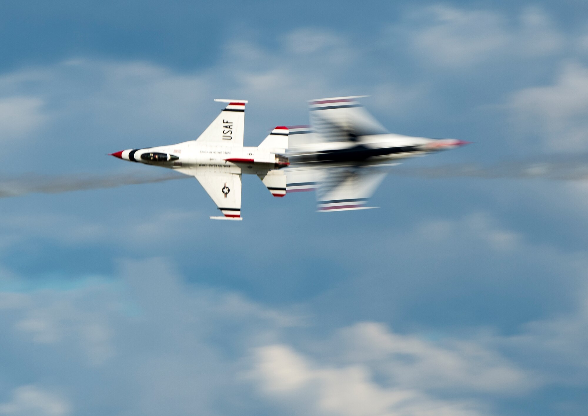 Two F-16 Fighting Falcons pass each other during Thunder Over South Georgia, Nov. 7, 2015 at Moody Air Force Base, Ga. The F-16s are part of the U.S. Air Force Thunderbirds demonstration team and were the main event for the open house. (U.S. Air Force photo/Tech. Sgt. Zachary Wolf)