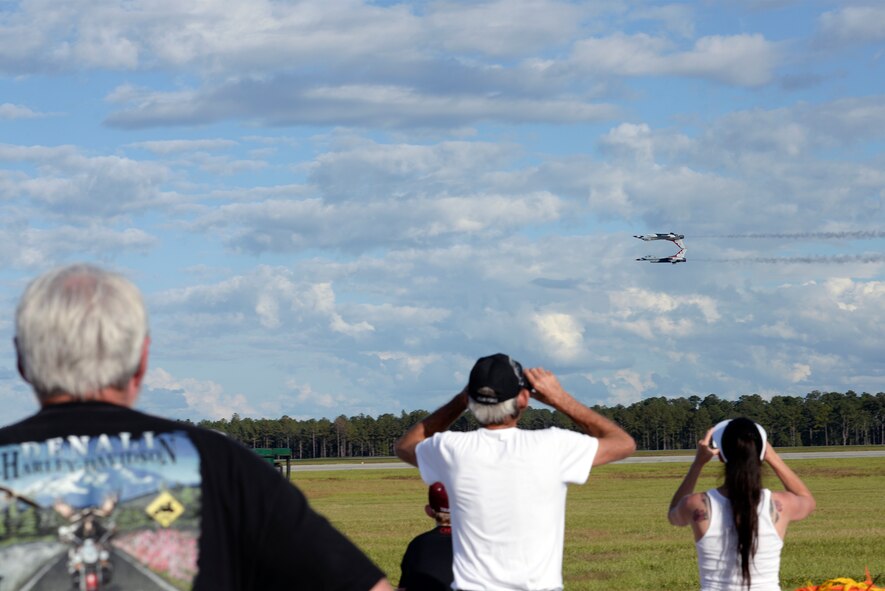 On-lookers watch the Thunderbirds demonstrate the capabilities of the F-16 Fighting Falcon during Thunder Over South Georgia, Nov. 7, 2015, at Moody Air Force Base, Ga. The open house included aerial performances, food, face painting and much more. (U.S. Air Force photo by Airman 1st Class Janiqua P. Robinson/Released)