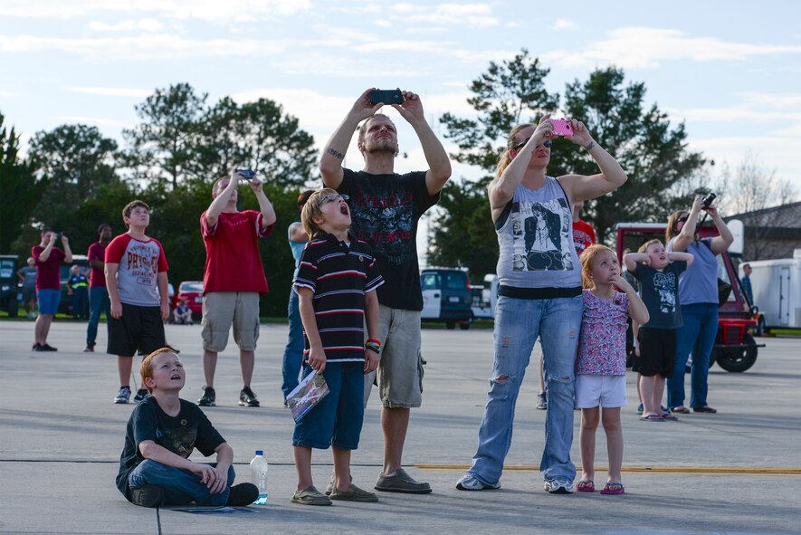 Adian, Eric, Robbie, Crystal and Haley Craven watch in awe as the Thunderbolts perform during Thunder Over South Georgia, Nov. 7, 2015, at Moody Air Force Base, Ga. The open house is an opportunity for Moody to thank the local community for all its support, and exhibit air power. (U.S. Air Force photo by Airman 1st Class Janiqua P. Robinson/Released)