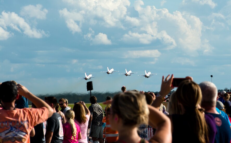 Attendees of Thunder Over South Georgia take photos while the U.S. Air Force Thunderbirds perform, Nov. 7, 2015 at Moody Air Force Base, Ga. The open house is one way Moody shows its appreciation to the local community. (U.S. Air Force photo/Tech. Sgt. Zachary Wolf)