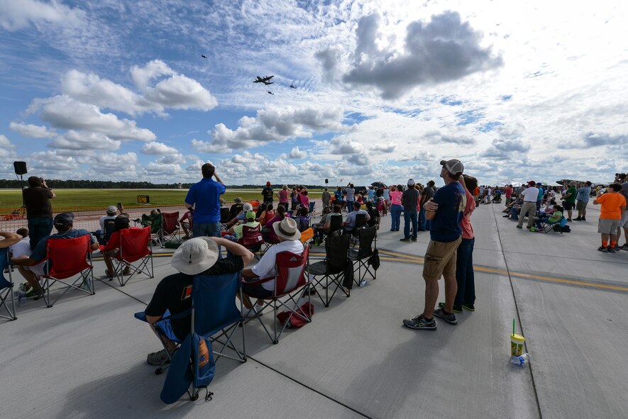 Crowds watch as pilots demonstrate an HC-130J Combat King II air-to-air refueling of two HH-60G Pave Hawk helicopters during Thunder Over South Georgia, Nov. 7, 2015, at Moody Air Force Base, Ga. The open house is an opportunity for Moody to thank the local community for all its support. (U.S. Air Force photo by Airman 1st Class Janiqua P. Robinson/Released))