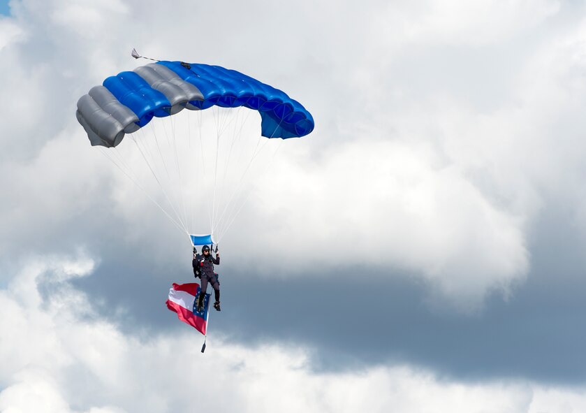A member of the U.S. Air Force Academy's Wings of Blue Parachute Team prepares to land with Georgia's state flag during Thunder Over South Georgia, Nov. 7, 2015 at Moody Air Force Base, Ga. Each year, more than 700 cadets are given the opportunity to earn their jump wings at the academy. (U.S. Air Force photo/Tech. Sgt. Zachary Wolf)