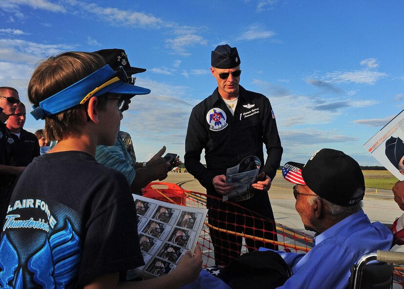 Lt. Col. Christopher Hammond, Commander, U.S. Air Force Air Demonstration Squadron, meets Thomas Deyampert, a Tuskegee Airman, at the Thunder Over South Georgia Open House Nov. 7 at Moody Air Force Base, Ga. Following the open house, the Thunderbirds met with thousands of attendees and signed autographs. (U.S. Air Force photo/Senior Airman Stephanie Englar)
