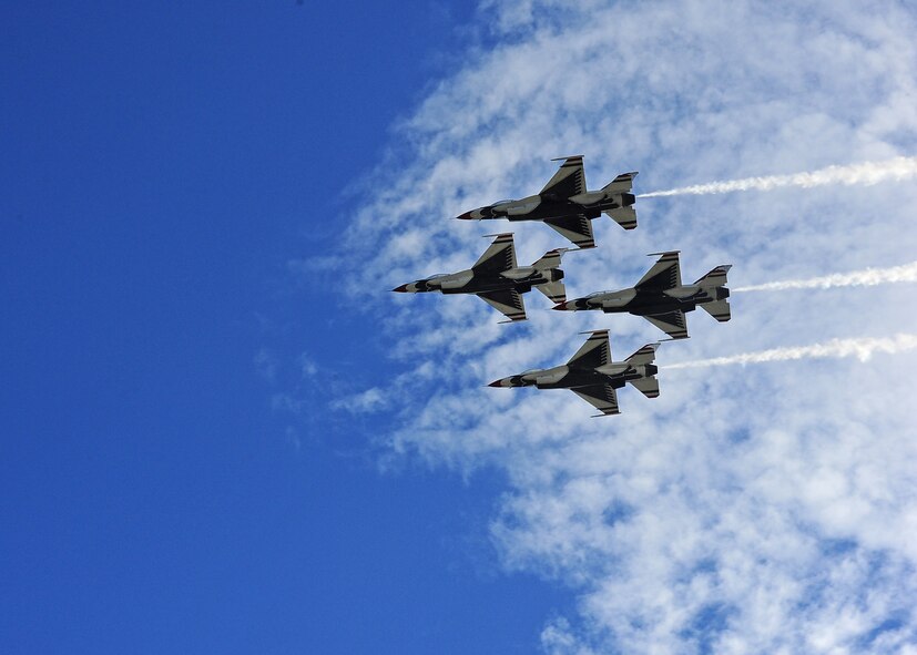 The U.S. Air Force Thunderbirds fly over a crowd of nearly 50,000 viewers during the Thunder Over South Georgia Open House Nov. 7 at Moody Air Force Base, Ga. The Thuderbirds showcase the skills and capabilities that all fighter pilots must possess as well as the maximum capabilities of the F-16 Fighting Falcon. (U.S. Air Force photo/Senior Airman Stephanie Englar)