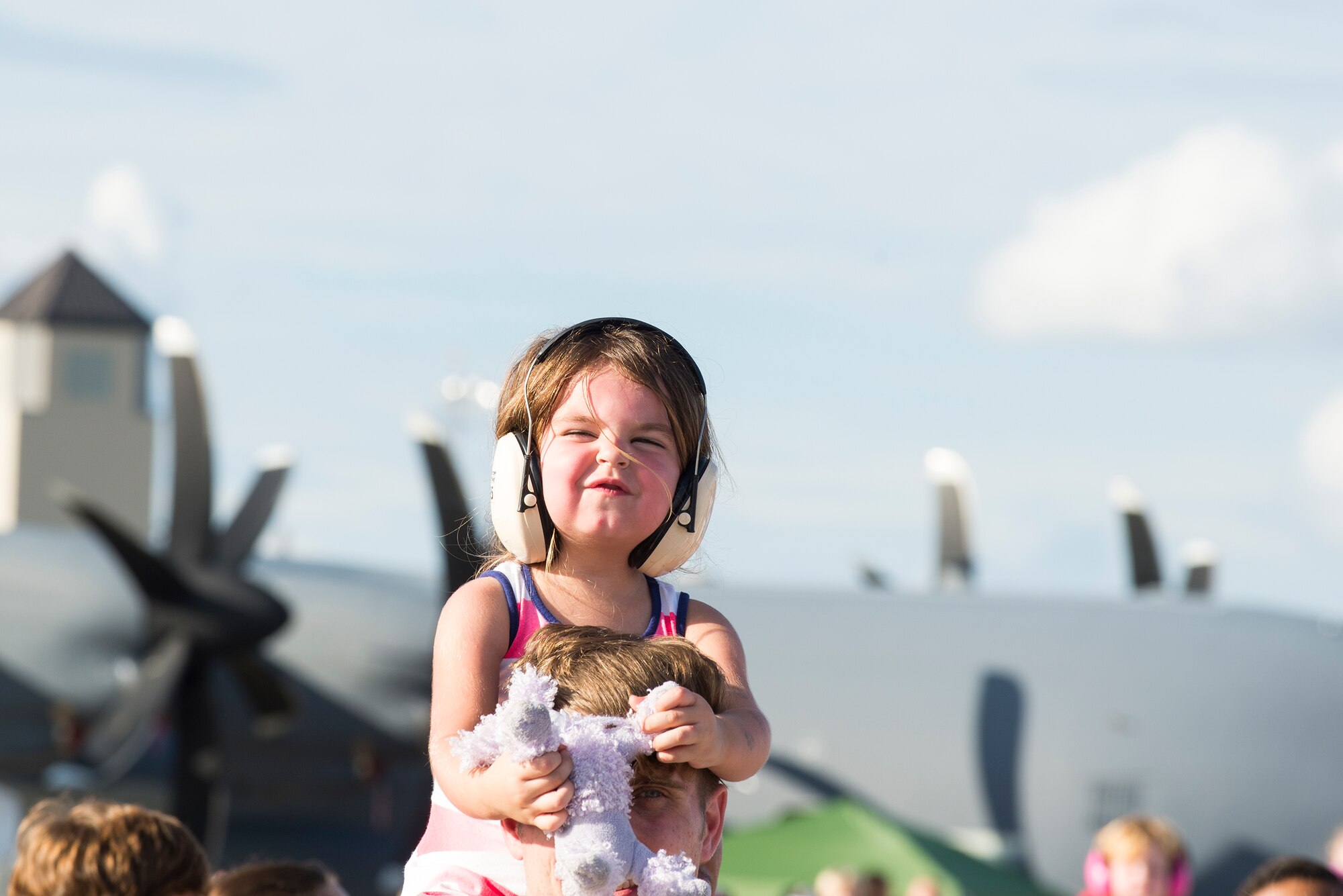 Amelia, daughter of Mark Jennsen, reacts to the loud sounds of the Thunderbirds’ F-16C Fighting Falcons during the Thunder Over South Georgia Open House, Nov. 7, 2015, at Moody Air Force Base, Ga. The open house is an opportunity for Moody to thank the local community for all its support. (U.S. Air Force photo by Senior Airman Ceaira Tinsley/Released)