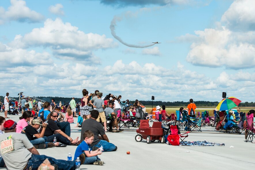 Guests in attendance observe an aerial demonstration during the Thunder Over South Georgia Open House, Nov. 7, 2015, at Moody Air Force Base, Ga. In addition to aerial performances, the event also included static displays of various aircraft. (U.S. Air Force photo by Senior Airman Ceaira Tinsley/Released)