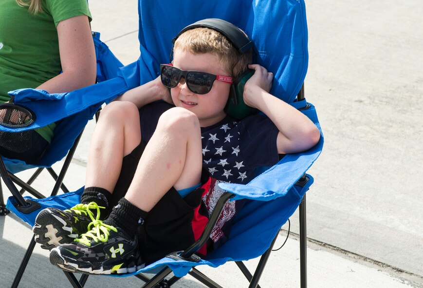 Dallas Griffith, son of U.S. Air Force Staff Sgt. Austin Lee, 38th Rescue Squadron, covers his ears during the Thunder Over South Georgia Open House, Nov. 7, 2015, at Moody Air Force Base, Ga. The open house included aerial performances, food, face painting and much more. (U.S. Air Force photo by Senior Airman Ceaira Tinsley/Released)