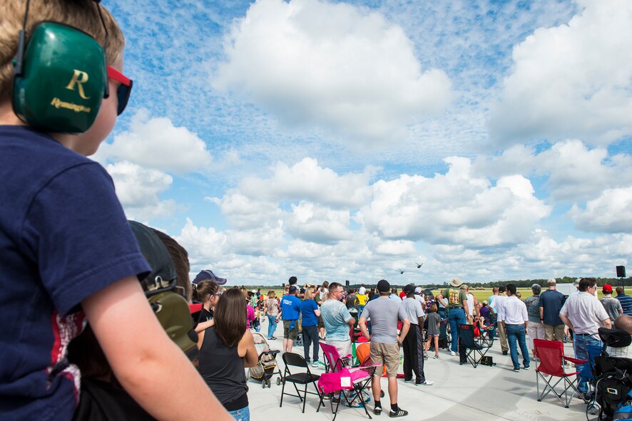 Guests in attendance observe two HH-60G Pave Hawks perform a combat search and rescue demonstration during the Thunder Over South Georgia Open House, Nov. 7, 2015, at Moody Air Force Base, Ga. The CSAR demonstration showcased Moody’s capabilities in a deployed environment. (U.S. Air Force photo by Senior Airman Ceaira Tinsley/Released)