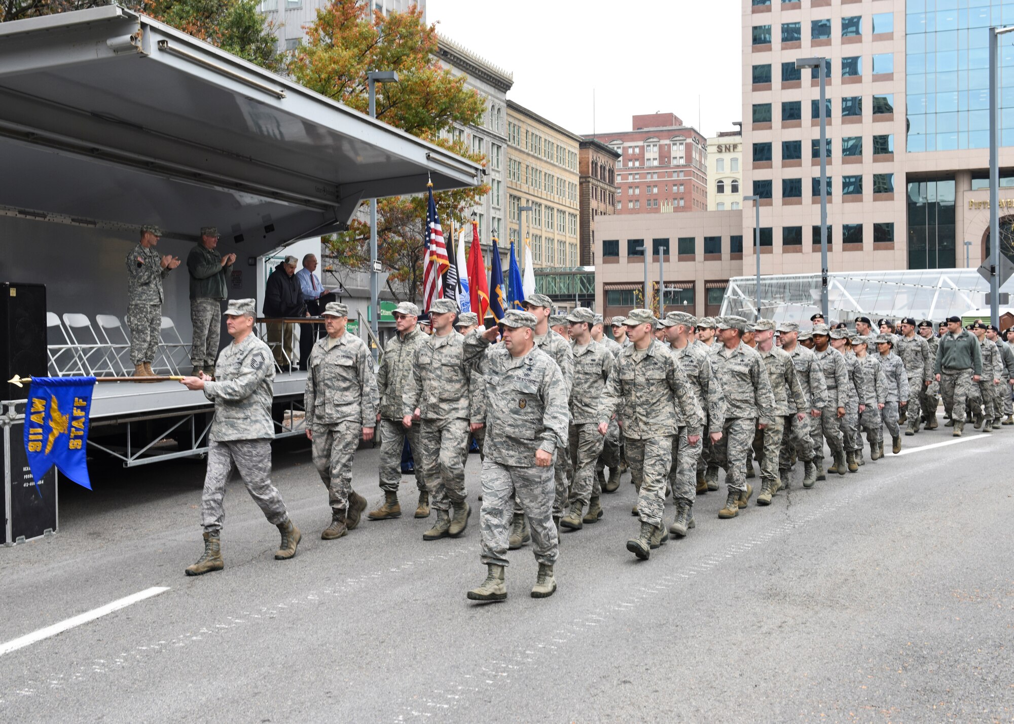 911th Airlift Wing Airmen perform Eyes Right as their troop commander, Lt. Col. Todd McCrann, salutes the 911th AW Commander, Col. Jeffrey A. Van Dootingh, downtown Pittsburgh, Nov. 7, 2015. Military members perform the drill movement, Eyes Right, to render military courtesy to reviewing officers and dignitaries during parades and ceremonies. (U.S. Air Force photo by Staff Sgt. Justyne Obeldobel) 