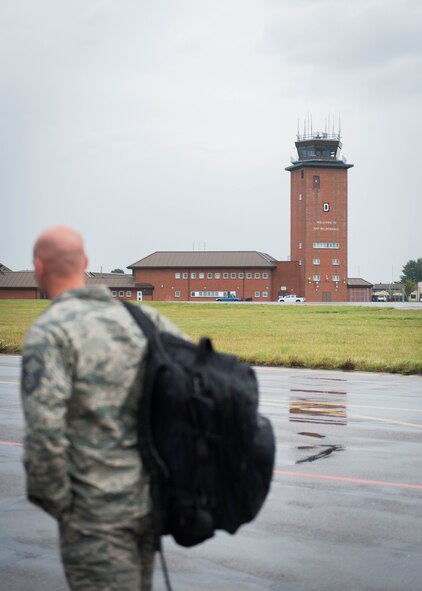 Master Sgt. Jason Prinsen, NCOIC at the Maintenance Operations Center, walks on the flight line at RAF Mildenhall, England, en route to Ramstein AB, Germany, in support of Exercise Swift Response.  (U.S. Air Force photo by Staff Sgt. Trevor Saylor/Released)