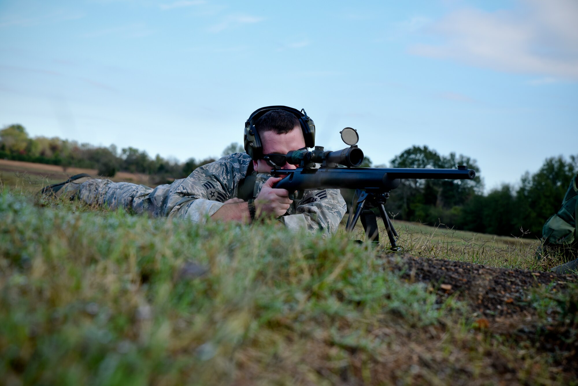 Senior Airman Corey Smith of the 188th Security Forces Squadron zeroes in his M-24 rifle during known distance sniper and advanced designated marksman qualification Nov. 6, 2015 at Fort Chaffee Joint Maneuver Training Center, Ark. The 188th SFS maintains combat readiness and efficiency through annual training on their designated weapons systems which allows them to remain proficient as marksmen. The training consisted of qualifications at 100, 300, 400, and 500 yards and with moving targets at designated distances. (U.S. Air National Guard photo by Capt. Holli Nelson)