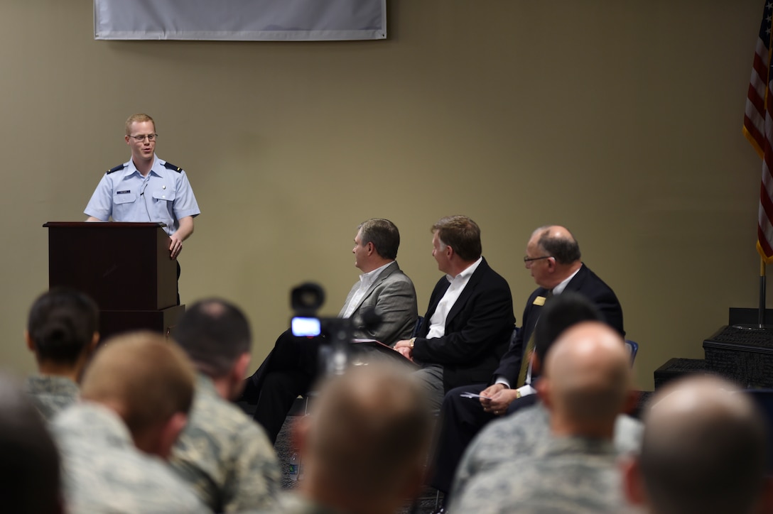 2nd Lt. Logan Huffman, company grade officer representative, introduces the distinguished panelists to members of the wing Nov. 6, 2015 during the Leadership Symposium at Ebbing Air National Guard Base, Ark. The Leadership Symposium, coordinated by the 188th CGOC, provided an open forum panel discussion for unit personnel with executive leaders in the Fort Smith area to learn and discuss leadership lessons from the corporate world. Dr. Paul Beran, Chancellor of the University of Arkansas - Fort Smith; Bob Arvin, Regional Vice President of Logistics for Wal-Mart; and Chris Sultemeier, Executive Vice President of Logistics for Wal-Mart, served as panelists for the symposium. (U.S. Air National Guard photo by Capt. Holli Nelson)