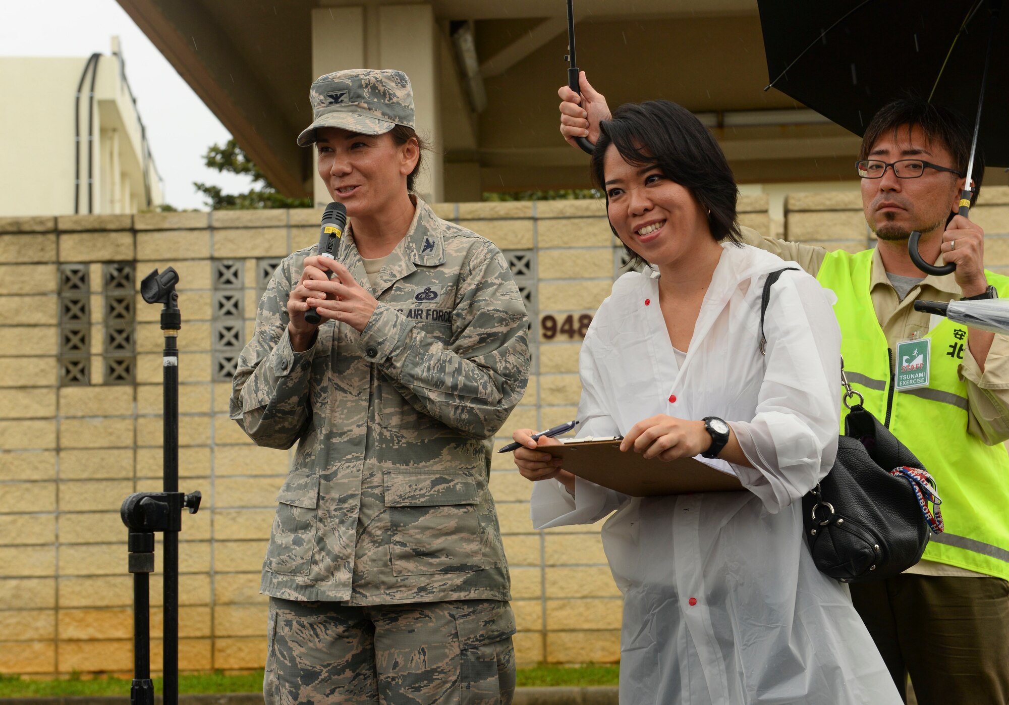 U.S. Air Force Col. Debra Lovette, 18th Mission Support Group commander, delivers a speech to participants of a tsunami evacuation exercise Nov. 5, 2015, at Kadena Air Base, Japan. Residents of Chatan Town were escorted on base, from Gate 1 to Gate 5, to practice evacuation procedures in the event of a tsunami. (U.S. Air Force photo by Senior Airman John Linzmeier)