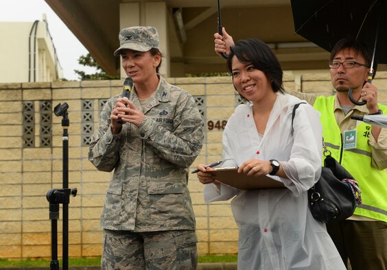 U.S. Air Force Col. Debra Lovette, 18th Mission Support Group commander, delivers a speech to participants of a tsunami evacuation exercise Nov. 5, 2015, at Kadena Air Base, Japan. Residents of Chatan Town were escorted on base, from Gate 1 to Gate 5, to practice evacuation procedures in the event of a tsunami. (U.S. Air Force photo by Senior Airman John Linzmeier)