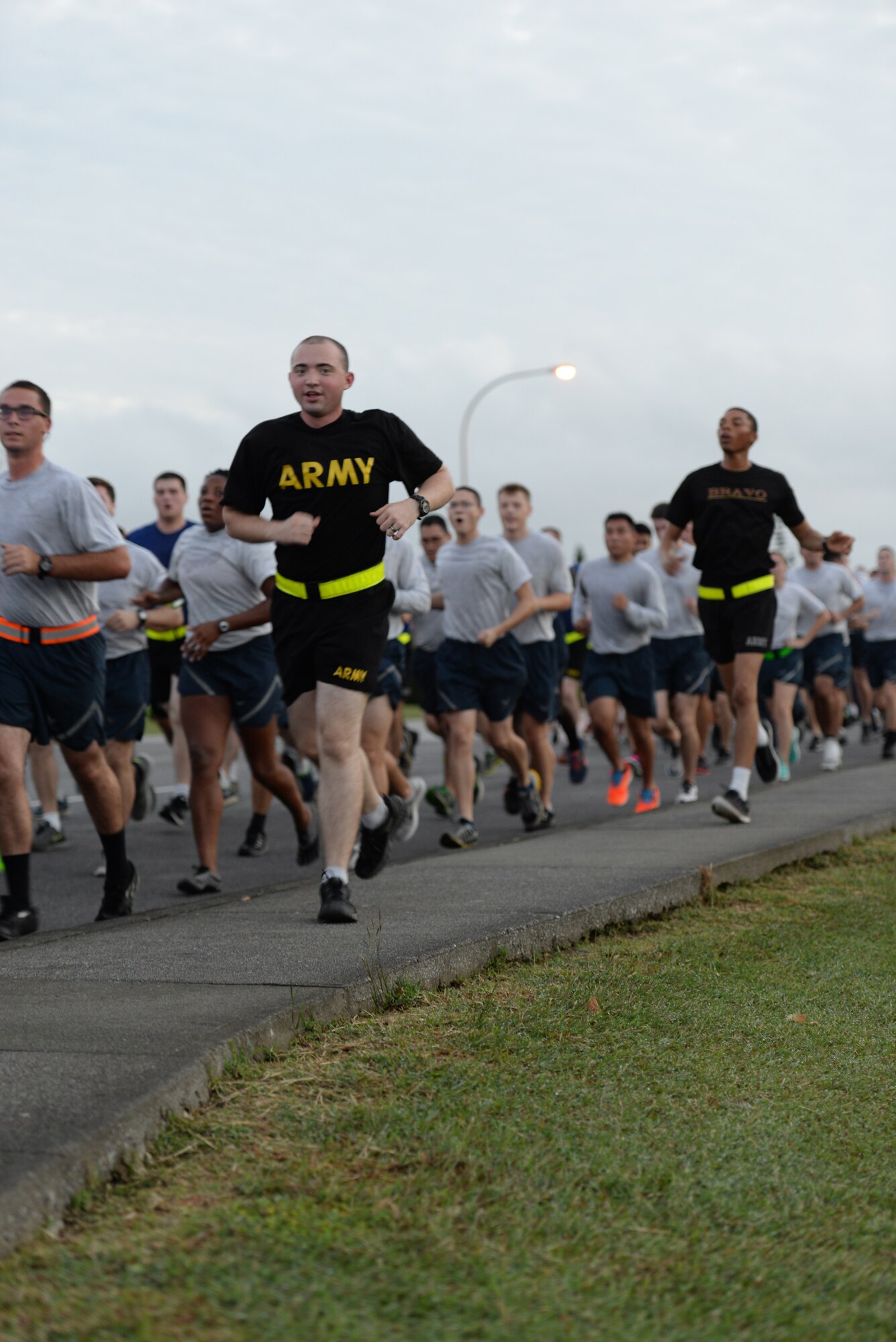 Team Kadena Airmen and Soldiers run together during an Army/Air Force 5K run Nov. 6, 2015, at Kadena Air Base, Japan. More than 500 runners turned out for the event, signifying strength and unity among sister services. (U.S. Air Force photo by Staff Sgt. Amber E. N. Jacobs)