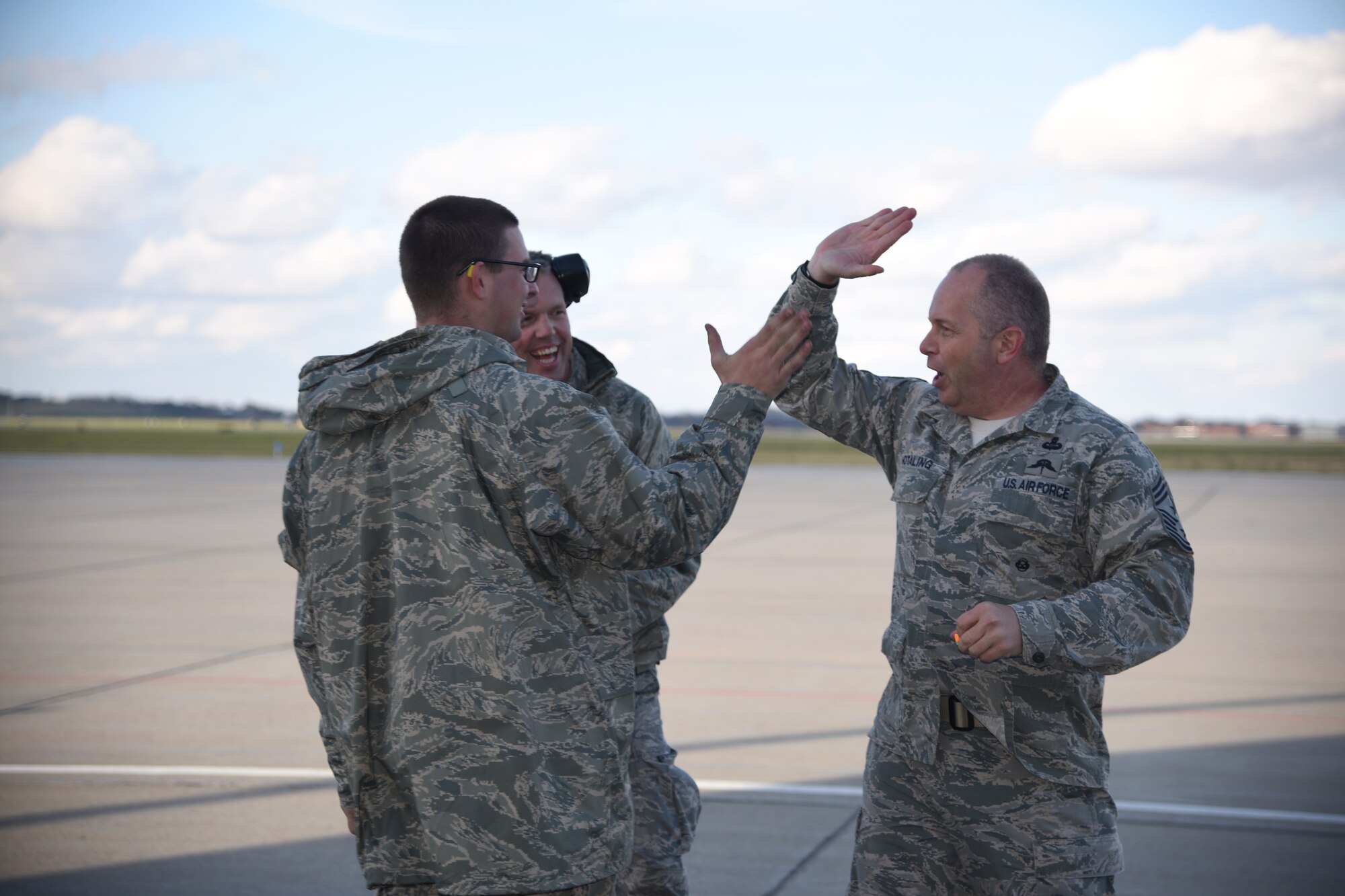 SIOUX FALLS, S.D. - Command Chief Master Sergeant of the Air National Guard James W. Hotaling gives Airman 1st Class Joseph Vandover, 114th Maintenance Group armament systems specialist, a high five after completion of the Chief's Challenge they participated in at Joe Foss Field, S.D. Nov. 6, 2015.  Hotaling was challenged to complete a timed course driving the MJ-1 Jammer and the Chief completed the course with an impressive time. (U.S. Air National Guard photo by Senior Master Sgt. Nancy Ausland/Released)