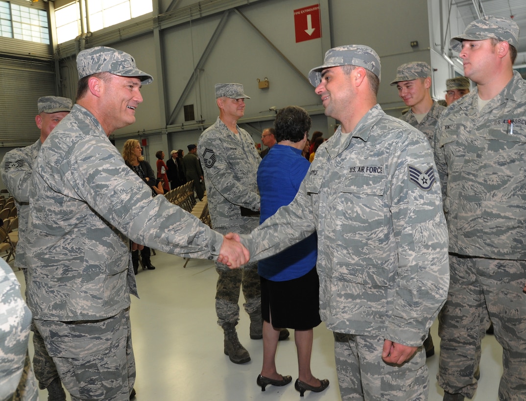 Brig. Gen. Michael E. Stencel, Adjutant General, Oregon, left, greets Staff Sgt. Joshua Joyce, assigned to the 142nd Fighter Wing Maintenance Group, right, during the formal demobilization ceremony, Nov. 6, 2015, Portland Air National Guard Base, Ore. (U.S. Air National Guard photo by Tech. Sgt. John Hughel, 142nd Fighter Wing Public Affairs/Released)